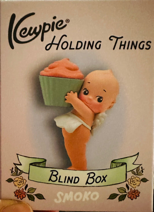Kewpie Holding Things
